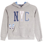 A heather gray pullover hoodie with a navy blue and white patterned 'NYC' graphic on the chest, a matching bow motif on the left front, and a blue-and-white patterned hood lining, shown on a plain white background.