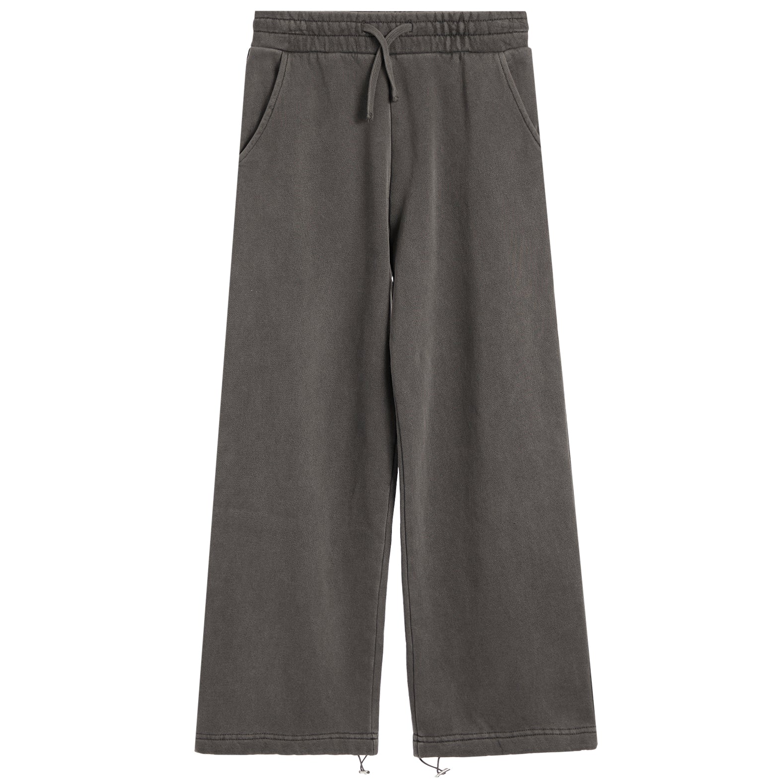 A pair of wide-leg sweatpants in a washed charcoal gray color, featuring an elastic waistband with a drawstring and side pockets, shown against a plain white background.