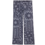 A pair of wide-leg pants in a dark gray fabric with a white paisley and floral bandana print, shown flat against a white background.