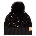 A black beanie hat with a large black faux fur pom-pom on top, covered in black sequins, featuring a ribbed knit cuff and a small tan 'cc' logo patch on the side.