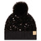 A black beanie hat with a large black faux fur pom-pom on top, covered in black sequins, featuring a ribbed knit cuff and a small tan 'cc' logo patch on the side.