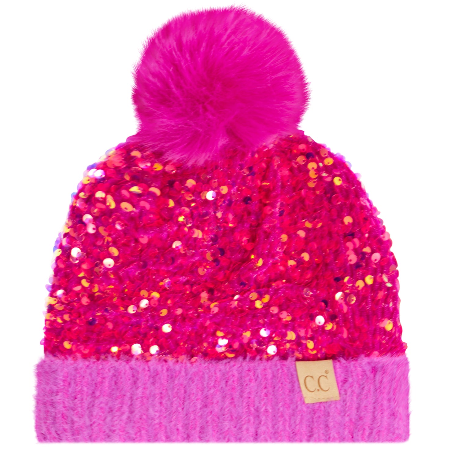 A bright pink beanie hat covered in sequins, featuring a fluffy pink pom-pom on top and a ribbed knit cuff with a small tan 'cc' logo patch.