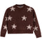 A dark brown knit sweater featuring a pattern of large, light pink stars with white outlines, displayed flat against a solid white background.