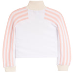 A cropped long-sleeve top with a solid white body and ribbed knit sleeves featuring vertical light pink and white stripes, finished with a cream ribbed mock neck and cuffs.