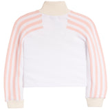 A cropped long-sleeve top with a solid white body and ribbed knit sleeves featuring vertical light pink and white stripes, finished with a cream ribbed mock neck and cuffs.