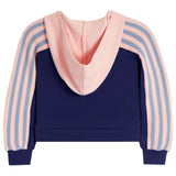 A cropped hoodie sweatshirt with a solid navy blue body, a light pink hood, and light pink and blue striped knit sleeves, shown against a plain white background.