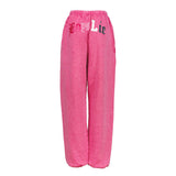 Pink heather sweatpants with 'Boys Lie' embroidered on the upper left hip in red and white, shown against a plain white background.