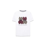 A white short-sleeve crewneck t-shirt featuring a graphic of two cartoon bunnies with skull patterns on the chest, labeled 'PSYCHO BUNNY'.