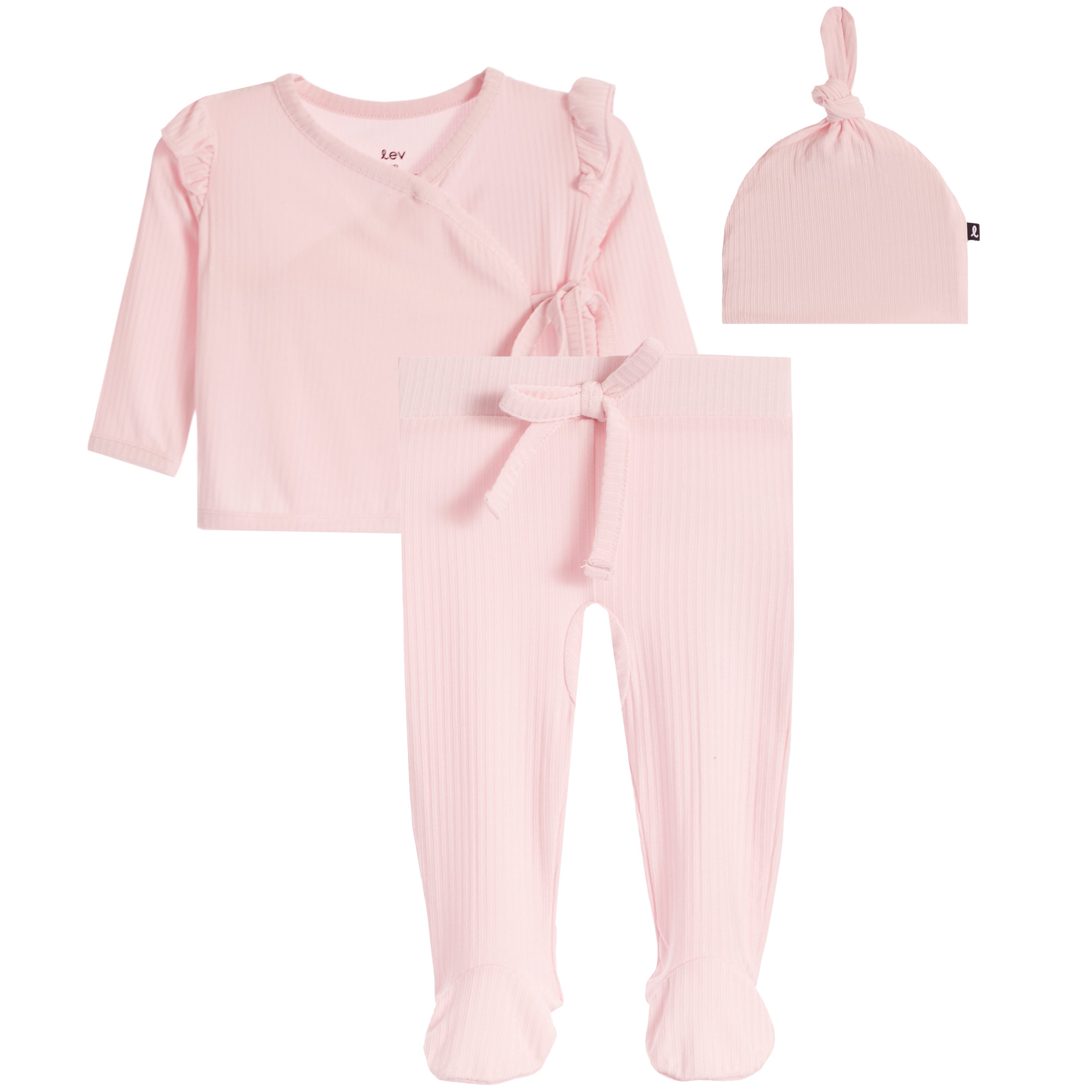 A three-piece baby outfit set in light pink ribbed fabric, including a long-sleeve wrap-style top with ruffle details, matching footed pants with a front bow, and a knotted beanie hat, displayed on a solid white background.
