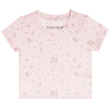 A light pink short-sleeve baby t-shirt with a delicate all-over floral print in shades of pink, green, and blue. The brand name 'KATIEJ' is printed inside the collar.