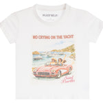A white short-sleeve graphic t-shirt by Katie J. The front features a colorful illustration of a pink convertible car with two women on a beach, accompanied by the text 'NO CRYING ON THE YACHT' and 'Saint Barth'.