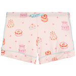Light pink pajama shorts with a watercolor-style print of cakes and decorated with small pink bows featuring a light blue drawstring waist and piping.
