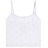 A white ribbed camisole tank top with thin straps and a repeating light blue bow pattern, shown flat against a white background.