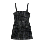 A sleeveless black tweed mini dress with thin shoulder straps, a square neckline, and two front flap pockets, shown on a plain white background.