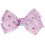 A light purple ribbon hair bow decorated with small pink rhinestones and a central iridescent bead accent, shown on a plain white background.