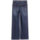 Back view of dark blue wide-leg denim jeans with a faded wash, featuring two back pockets and belt loops.