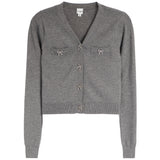 A gray knit cardigan with a V-neck, long sleeves, and decorative bow details on the chest pockets and front button closure, shown against a plain white background.