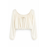 An off-white long-sleeve crop top with a gathered, ruffled neckline and a small front tie detail, shown against a plain white background.