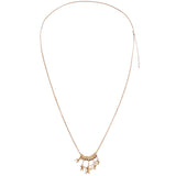 A delicate gold chain necklace featuring a central cluster of small gold beads and dangling star charms, displayed against a solid white background.