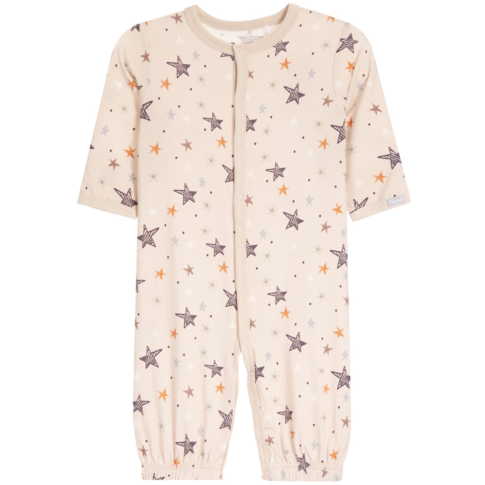 A baby's short-sleeve footless one-piece jumpsuit in a warm cream color, decorated with an all-over pattern of stars in brown, orange, and light blue, and small dots. It features a snap-button front closure and elastic cuffs.