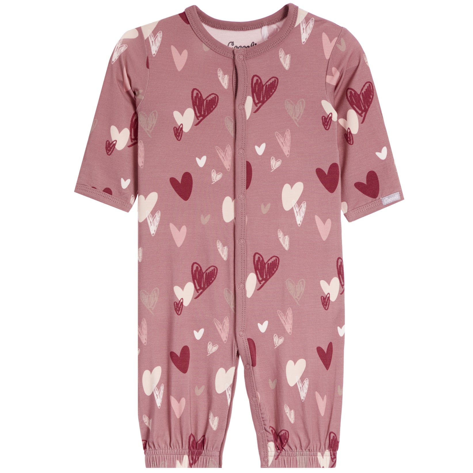 A baby short-sleeve footless one-piece romper in dusty rose pink, featuring an all-over pattern of hearts in dark red, light pink, and off-white. The romper has a front zipper closure and elastic cuffs at the ankles, shown against a plain white background.