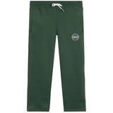 Dark green sweatpants with a white drawstring and a circular white bigger than baskeyball logo on the left thigh, shown flat against a white background.