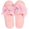 A pair of fluffy pink slip-on slippers decorated with layered tulle flower bows and small rhinestone accents, shown on a plain white background.