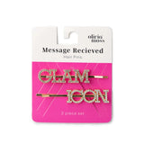 Olivia Moss Message Recieved Hair Pins set, featuring two gold bobby pins with rhinestone-embellished letters spelling 'GLAM' and 'ICON' on a pink and white retail card.