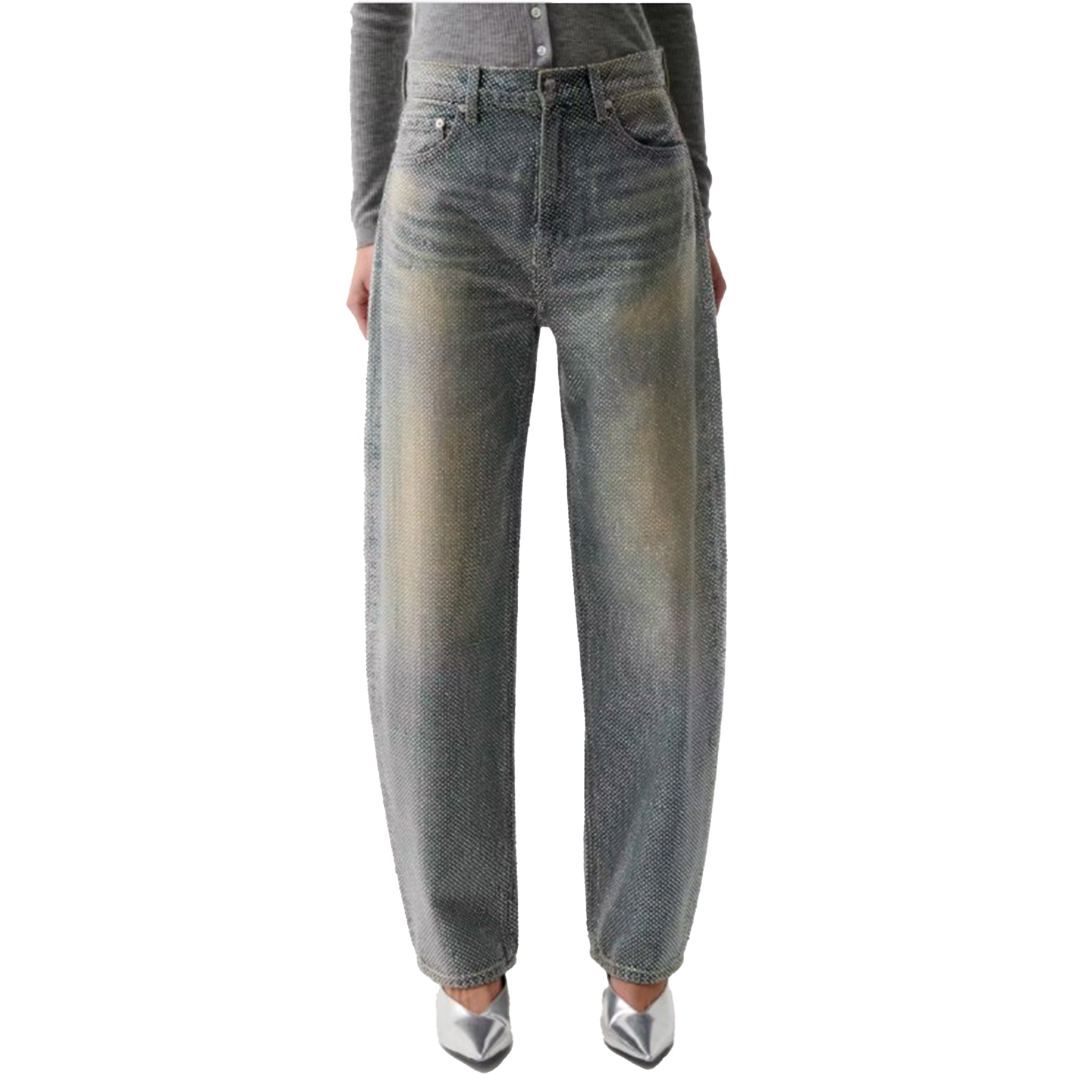 A person wearing faded gray wide-leg jeans with a subtle yellowish wash on the front, paired with a gray long-sleeve top and metallic silver pointed shoes, shown against a plain white background.
