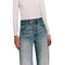A model wearing high-waisted, wide-leg blue jeans covered in sparkling rhinestones, paired with a light beige long-sleeve top, shown against a plain white background.