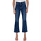 A model wearing a pair of dark blue cropped flare jeans with a white top and beige strappy heels, shown against a plain white background.