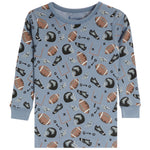A light blue long-sleeve children's pajama shirt with an all-over football-themed print featuring brown and white footballs, black helmets, and football tackles on a white background.