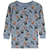 A light blue long-sleeve children's pajama shirt with an all-over football-themed print featuring brown and white footballs, black helmets, and football tackles on a white background.