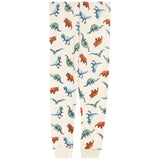 A pair of cream-colored sweatpants with an all-over dinosaur print in shades of blue, green, and orange, featuring ribbed cuffs at the bottom.