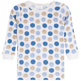 A long-sleeve baby shirt with a white base and an all-over pattern of smiling face circles in shades of blue and beige.
