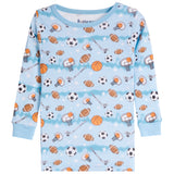 A light blue long-sleeve children's shirt with an all-over sports print featuring basketballs, footballs, soccer balls, hockey pucks, and hockey sticks.