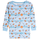A light blue long-sleeve children's shirt with an all-over sports print featuring basketballs, footballs, soccer balls, hockey pucks, and hockey sticks.