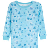 A light blue long-sleeve waffle-knit pajama top with a festive Hanukkah pattern featuring dreidels, menorahs, and stars in various shades of blue.