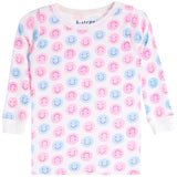 A white long-sleeve baby top with an all-over pattern of pink and light blue smiley faces, featuring a crew neck and ribbed cuffs.