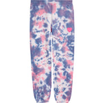 Tie-dye sweatpants in a pink, purple, and white pattern with a small pink heart on the left thigh, shown flat against a white background.