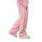 A person wearing light pink sweatpants and white sneakers, shown from the waist down in a side-profile pose against a plain white background.