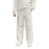 A person wearing a matching light heather gray sweatshirt and wide-leg sweatpants, paired with white sneakers, shown against a plain white background.