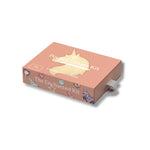 A peach-colored rectangular box labeled 'Pocket Create Kit' and 'The Enchanted Kit' with a gold unicorn silhouette on top, shown at an angle on a white background.