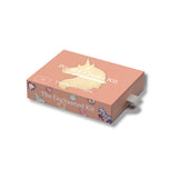 A peach-colored rectangular box labeled 'Pocket Create Kit' and 'The Enchanted Kit' with a gold unicorn silhouette on top, shown at an angle on a white background.