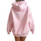 A person shown from the back wearing an oversized light pink hoodie with a subtle all-over small dot pattern, photographed against a plain white background.