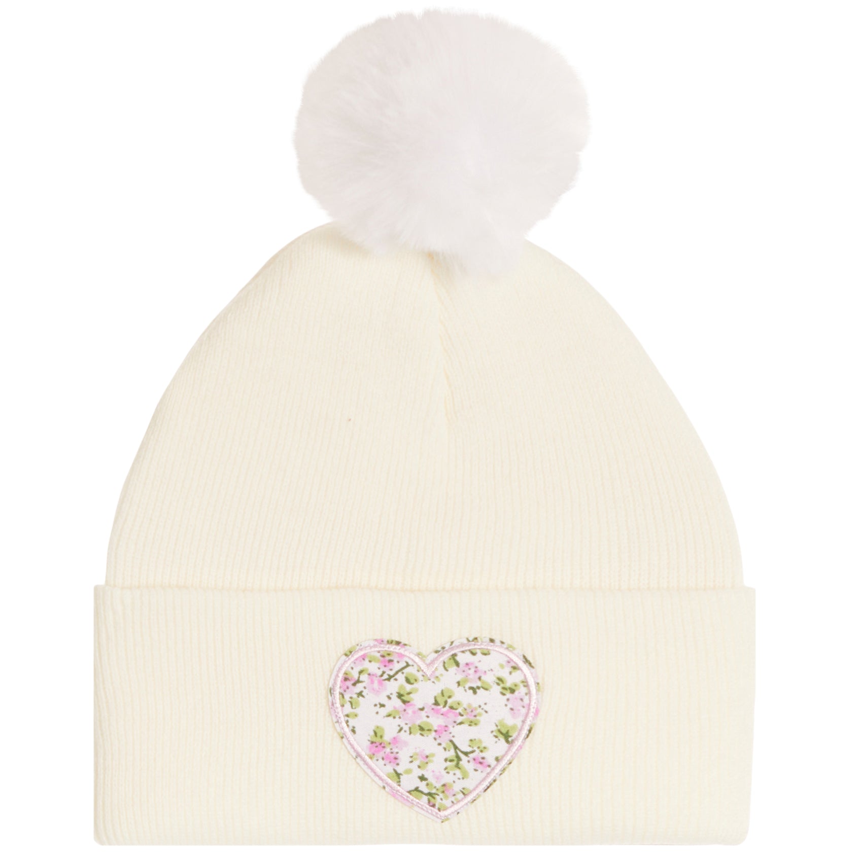 An off-white ribbed knit pom-pom beanie featuring a pink and green floral heart patch on the front cuff.