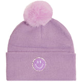 A light purple ribbed knit beanie with a fluffy matching pom-pom on top and a circular embroidered smiley face patch on the front cuff.