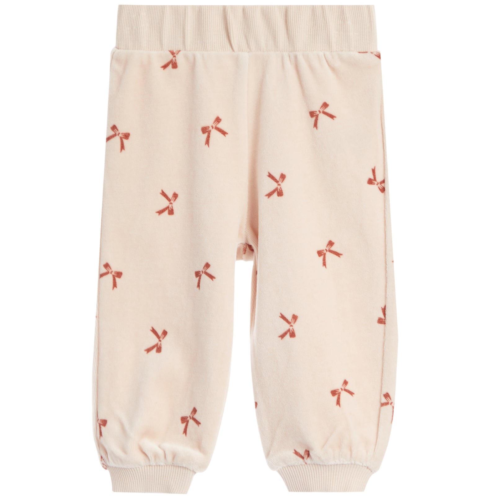 A pair of cream-colored fleece pants with a repeating pattern of small red bows, featuring an elastic waistband and ribbed ankle cuffs.