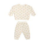A two-piece baby loungewear set consisting of a long-sleeve top and matching pants in cream with a small beige floral pattern, displayed on a solid white background.