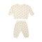 A two-piece baby loungewear set consisting of a long-sleeve top and matching pants in cream with a small beige floral pattern, displayed on a solid white background.